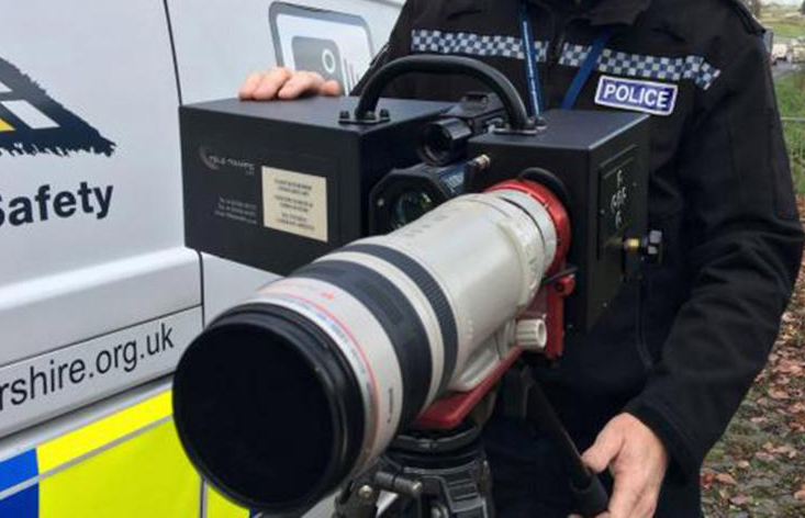 Police Officer showing off new Long Range Speed Camera